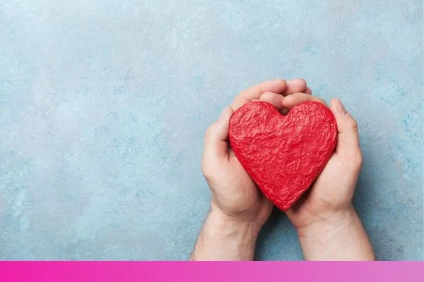 a person holding a heart